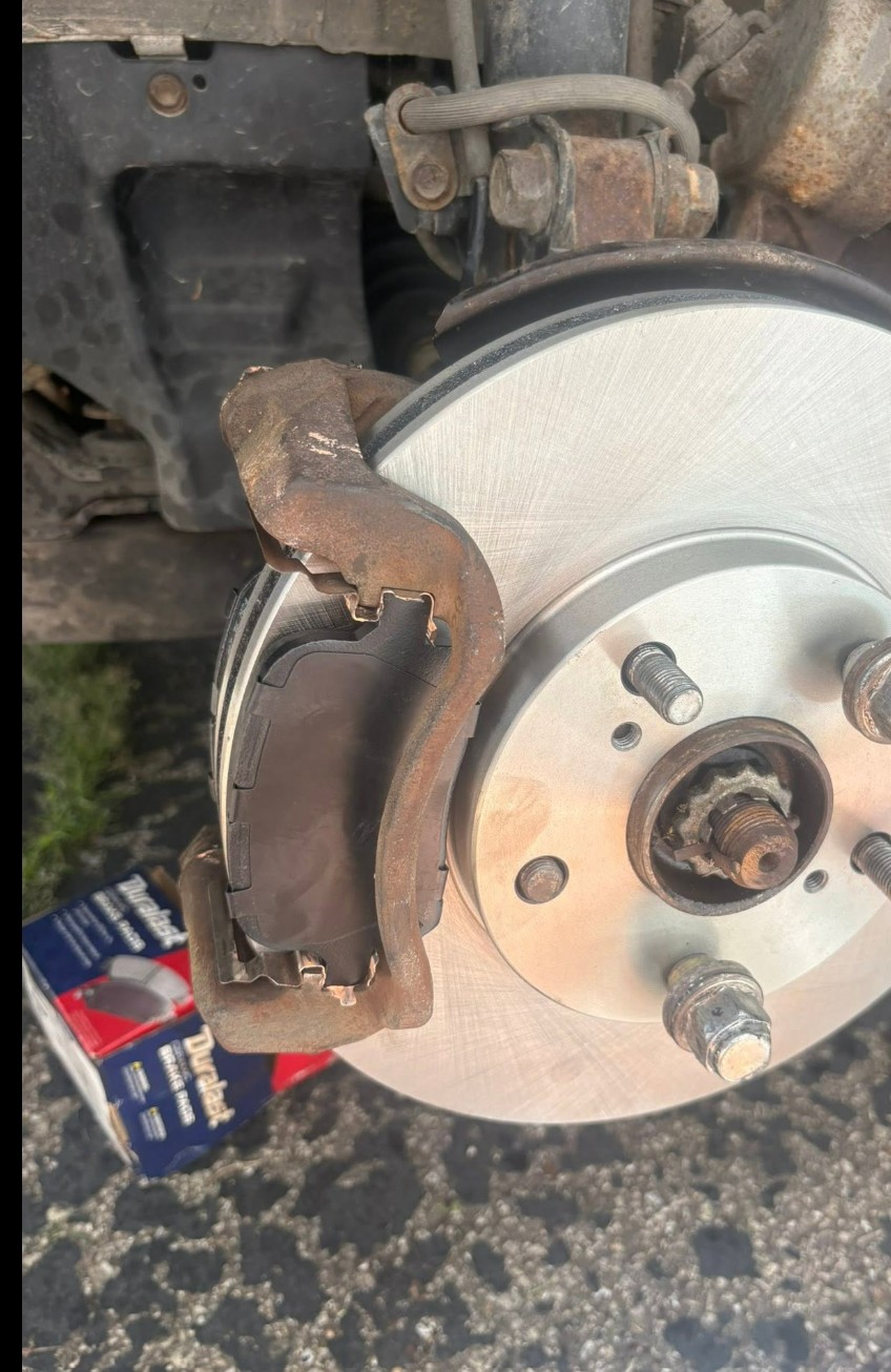 New brake rotor and pads installed